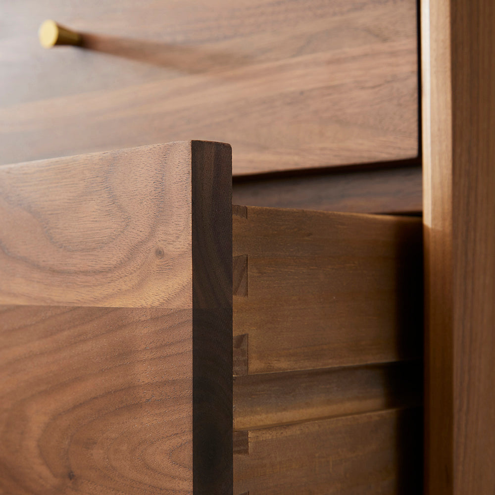 Close-up of a wooden drawer with a focus on texture and grain.